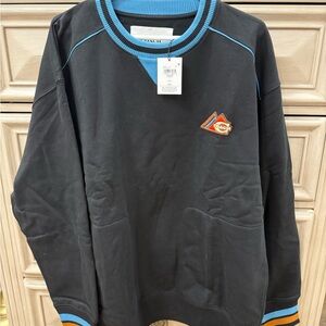 Coach Black Crewneck Sweater with Blue and Orange Accents